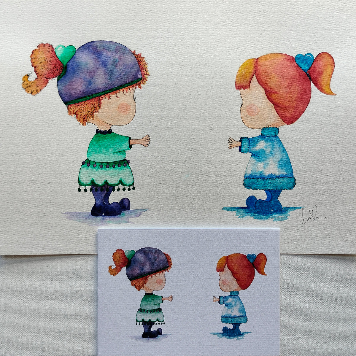 Mira & Friend - Green and Blue Outfits – Watercolour Art Card shown with Original Painting (not for sale) | JoliArtes
