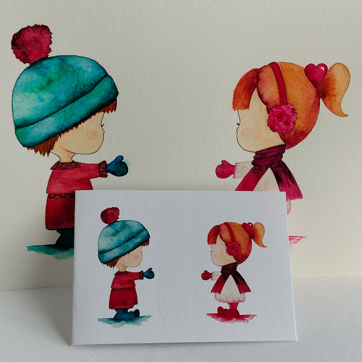 Mira & Theo - Red and Pink Outfits – Watercolour Art Card shown with Original Painting (not for sale) | JoliArtes